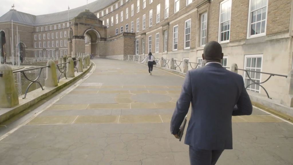 Young Filmmakers- Man walking towards the Bristol Council building